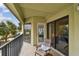 Enjoy the relaxing atmosphere on this balcony with water views and stylish outdoor seating at 74 Gulf Blvd # 1B, Indian Rocks Beach, FL 33785