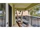 Relax on this balcony with outdoor seating, palm tree views, and enjoy the surrounding scenery at 74 Gulf Blvd # 1B, Indian Rocks Beach, FL 33785