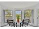 Balcony seating area offering views of the community and lush landscaping at 74 Gulf Blvd # 1B, Indian Rocks Beach, FL 33785