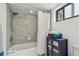 Bathroom featuring modern tiled shower, towels, and a toilet at 74 Gulf Blvd # 1B, Indian Rocks Beach, FL 33785