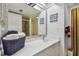 Bathroom featuring single sink vanity with large mirror and a glass enclosed shower at 74 Gulf Blvd # 1B, Indian Rocks Beach, FL 33785