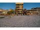 Relaxing beachfront condo with chairs on the sand, palm trees, and multiple balconies for enjoying ocean views at 74 Gulf Blvd # 1B, Indian Rocks Beach, FL 33785