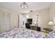 Cozy bedroom with a comfortable bed, modern lighting, and a functional workspace for added convenience at 74 Gulf Blvd # 1B, Indian Rocks Beach, FL 33785