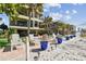 Charming condo with beach access featuring beautiful landscaping and cozy outdoor seating at 74 Gulf Blvd # 1B, Indian Rocks Beach, FL 33785