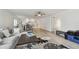 Spacious living area blending seamlessly with the kitchen and dining area at 74 Gulf Blvd # 1B, Indian Rocks Beach, FL 33785