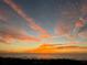 Beautiful ocean sunset with colorful sky, showcasing the tranquil coastal environment at 74 Gulf Blvd # 1B, Indian Rocks Beach, FL 33785