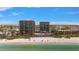 Beautiful aerial view of beachfront condos with a pool and beach access at 7600 Bayshore Dr # 204, Treasure Island, FL 33706