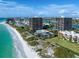 Aerial view of the beachfront condos along the shore at 7600 Bayshore Dr # 204, Treasure Island, FL 33706