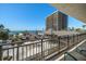 Balcony view showcasing the beachfront high-rise, surrounding landscape, and sandy beach at 7600 Bayshore Dr # 204, Treasure Island, FL 33706