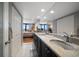 Well-lit bathroom featuring granite counters and access to the main bedroom at 7600 Bayshore Dr # 204, Treasure Island, FL 33706