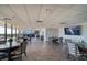 Elegant clubhouse area featuring tables, chairs, and a view of the ocean at 7600 Bayshore Dr # 204, Treasure Island, FL 33706