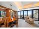 Stunning dining room with ocean view, adjacent to a sitting room and balcony access at 7600 Bayshore Dr # 204, Treasure Island, FL 33706
