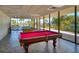 Spacious game room with views, a red billiards table and a green billiards table at 7600 Bayshore Dr # 204, Treasure Island, FL 33706