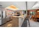 Bright kitchen with granite countertops, tile backsplash, stainless appliances and bar seating at 7600 Bayshore Dr # 204, Treasure Island, FL 33706