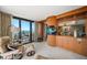 Relaxing living room featuring large glass doors with an ocean view at 7600 Bayshore Dr # 204, Treasure Island, FL 33706
