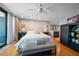 Comfortable main bedroom with a plush bed, neutral walls, and a ceiling fan at 7600 Bayshore Dr # 204, Treasure Island, FL 33706