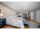 Spacious bedroom featuring a king bed, hardwood floors, and bright natural light at 7600 Bayshore Dr # 204, Treasure Island, FL 33706