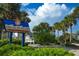 Treasure Island Beach Pavilion and Park sign surrounded by palm trees under blue skies at 7600 Bayshore Dr # 204, Treasure Island, FL 33706