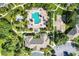 Aerial view of the community pool, splash pool, clubhouse, and recreational courts at 8926 Manor Loop # 207, Lakewood Ranch, FL 34202