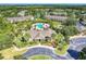 Aerial shot showcases the clubhouse, pool area, and nearby residential buildings within the community at 8926 Manor Loop # 207, Lakewood Ranch, FL 34202