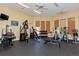 Fully equipped gym featuring various machines and free weights for a complete fitness routine at 8926 Manor Loop # 207, Lakewood Ranch, FL 34202