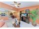 Open concept living room with view into dining area and kitchen with modern appliances at 8926 Manor Loop # 207, Lakewood Ranch, FL 34202