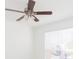 Bedroom featuring a ceiling fan and natural light from window with bright white blinds at 9481 Highland Oak Dr # 413, Tampa, FL 33647