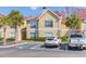 Inviting condo exterior with palm trees and designated parking spots in front at 9481 Highland Oak Dr # 413, Tampa, FL 33647