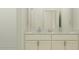 Bright bathroom featuring double sinks, a modern vanity with granite countertop, and subway tile in shower at 9705 Runaway Breeze Dr, Land O Lakes, FL 34637