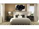 Serene bedroom with neutral tones, featuring a comfortable bed, modern nightstands, and soft lighting at 9705 Runaway Breeze Dr, Land O Lakes, FL 34637
