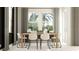 Charming dining room featuring a light wood table, modern chairs, and bright natural light at 9705 Runaway Breeze Dr, Land O Lakes, FL 34637