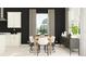 Modern dining room with contrasting black and white walls, stylish light wood table, and ample natural light at 9705 Runaway Breeze Dr, Land O Lakes, FL 34637