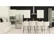 Modern kitchen with white cabinets, stainless steel appliances, a kitchen island with seating, and modern decor at 9705 Runaway Breeze Dr, Land O Lakes, FL 34637