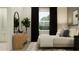 Stylish bedroom with dark curtains, a modern dresser, and large windows provides a tranquil retreat at 9705 Runaway Breeze Dr, Land O Lakes, FL 34637