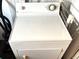 White GE dryer with multiple settings, located in the laundry area of the home at 9790 66Th N St # 206, Pinellas Park, FL 33782
