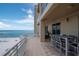 Balcony with dining and seating has sweeping views of the beach and ocean at 10 Papaya St # 1404, Clearwater Beach, FL 33767