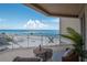 Inviting balcony with seating features views of the beach at 10 Papaya St # 1404, Clearwater Beach, FL 33767