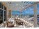 Expansive balcony with amazing waterfront views with outdoor seating for relaxing and entertaining at 10 Papaya St # 1404, Clearwater Beach, FL 33767