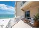 Relaxing balcony featuring comfortable seating and serene views of the beach at 10 Papaya St # 1404, Clearwater Beach, FL 33767