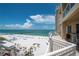 Expansive balcony with seating area offers stunning views of the beach and Gulf at 10 Papaya St # 1404, Clearwater Beach, FL 33767