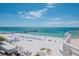 Stunning beach view from a balcony, featuring the pier, blue skies, and turquoise waters at 10 Papaya St # 1404, Clearwater Beach, FL 33767