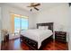 Spacious bedroom with ocean view, hardwood floors, balcony access, creating a serene and luxurious living space at 10 Papaya St # 1404, Clearwater Beach, FL 33767