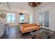 Inviting living area featuring hardwood floors, modern lighting, and large windows with scenic views at 10 Papaya St # 1404, Clearwater Beach, FL 33767