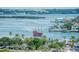 Scenic waterfront view featuring a pirate ship, docks, palm trees and city skyline in the distance at 10 Papaya St # 1404, Clearwater Beach, FL 33767