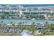 Picturesque waterfront view overlooking homes, boats, and Marina Cantina Restaurant, framed by palm trees at 10 Papaya St # 1404, Clearwater Beach, FL 33767