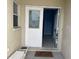 Inviting front door entrance with decorative glass detail leading into the home's bright interior at 10127 Barnett Loop, Port Richey, FL 34668