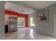 Dining room featuring stainless refrigerator, polished terrazzo floor and large windows at 10828 99Th Pl, Seminole, FL 33772