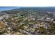 An aerial view of homes nestled among trees, close to main roads, offering a blend of nature and accessibility at 112 Forest Cir, Safety Harbor, FL 34695