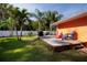 Spacious backyard deck with colorful Adirondack chairs, ideal for entertaining or enjoying a quiet afternoon at 112 Forest Cir, Safety Harbor, FL 34695