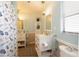 Bathroom featuring a single vanity, framed mirrors, and shower with a curtain at 112 Forest Cir, Safety Harbor, FL 34695